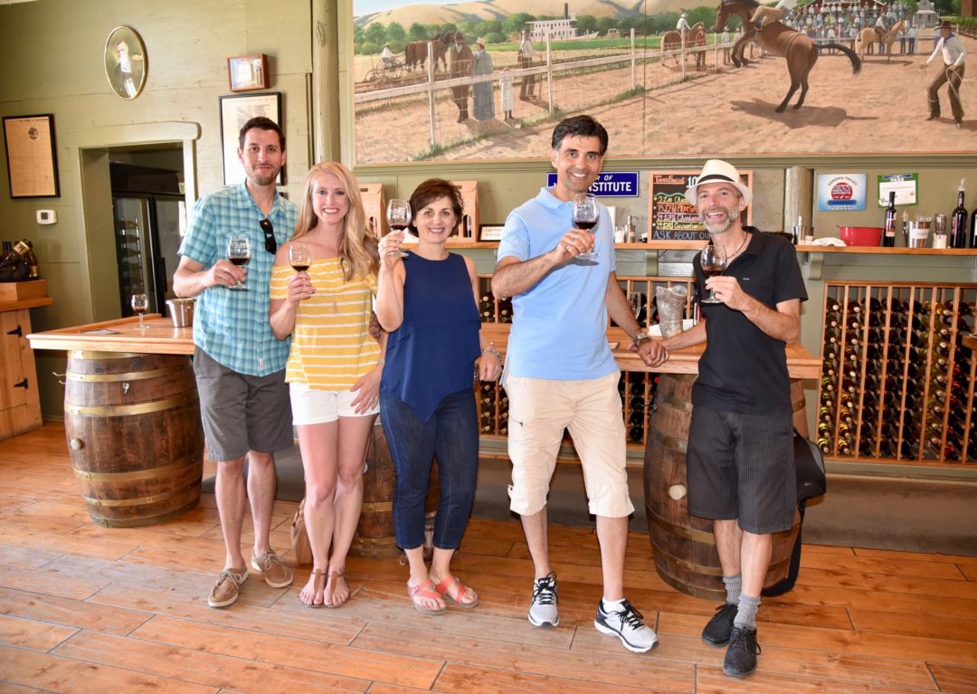 group inside a winery on a wine tour