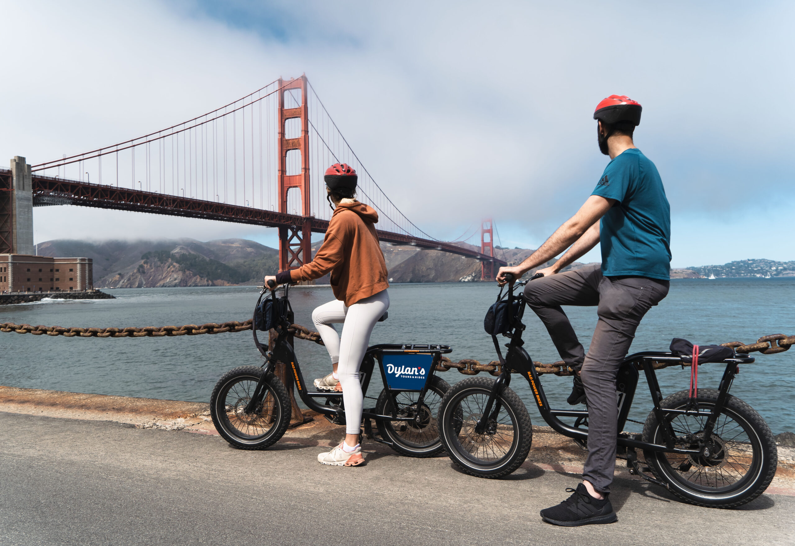 People on an E-bike date looking at the Golden Gate Bridge