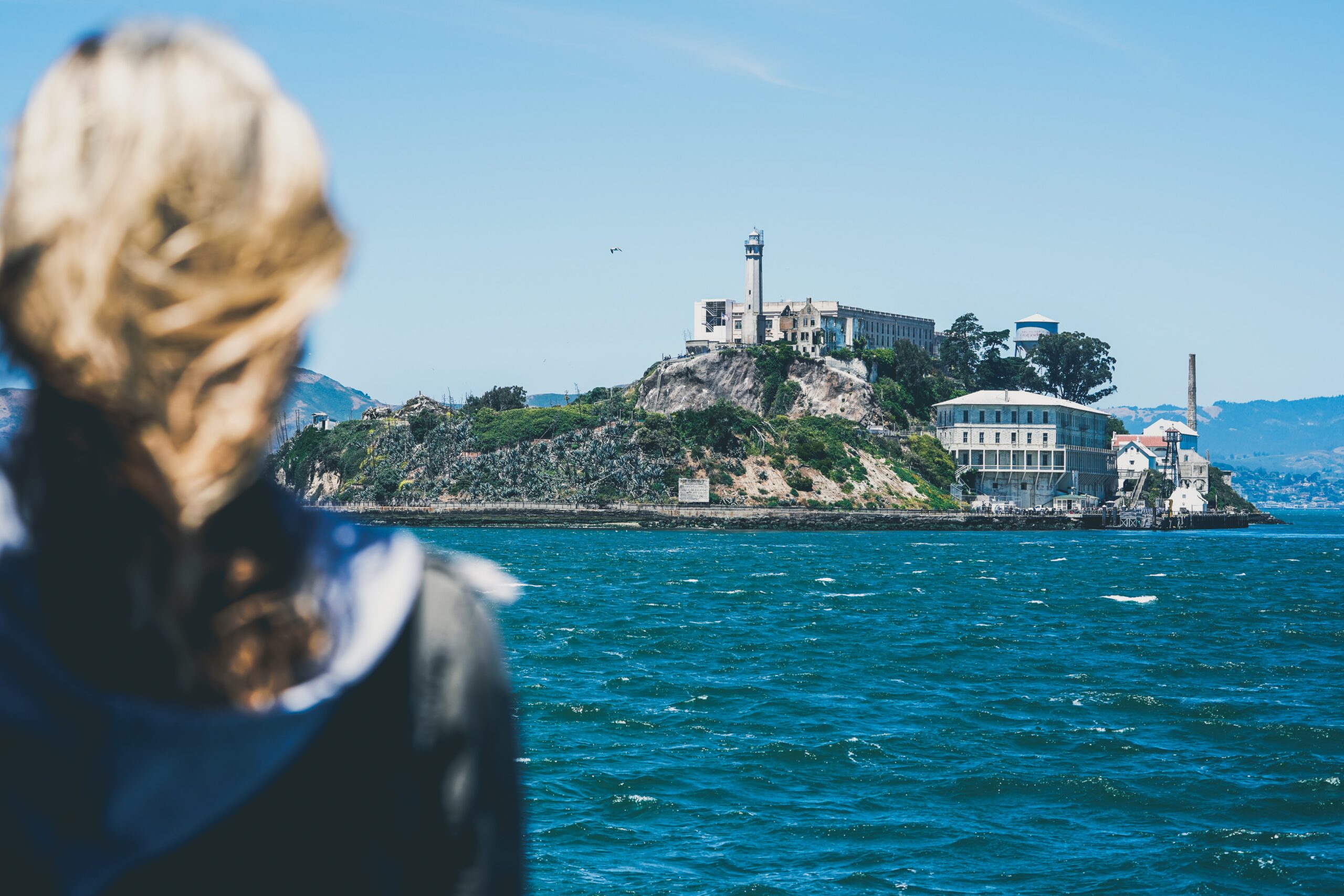 Person looking at the view of Alcatraz from the ferry