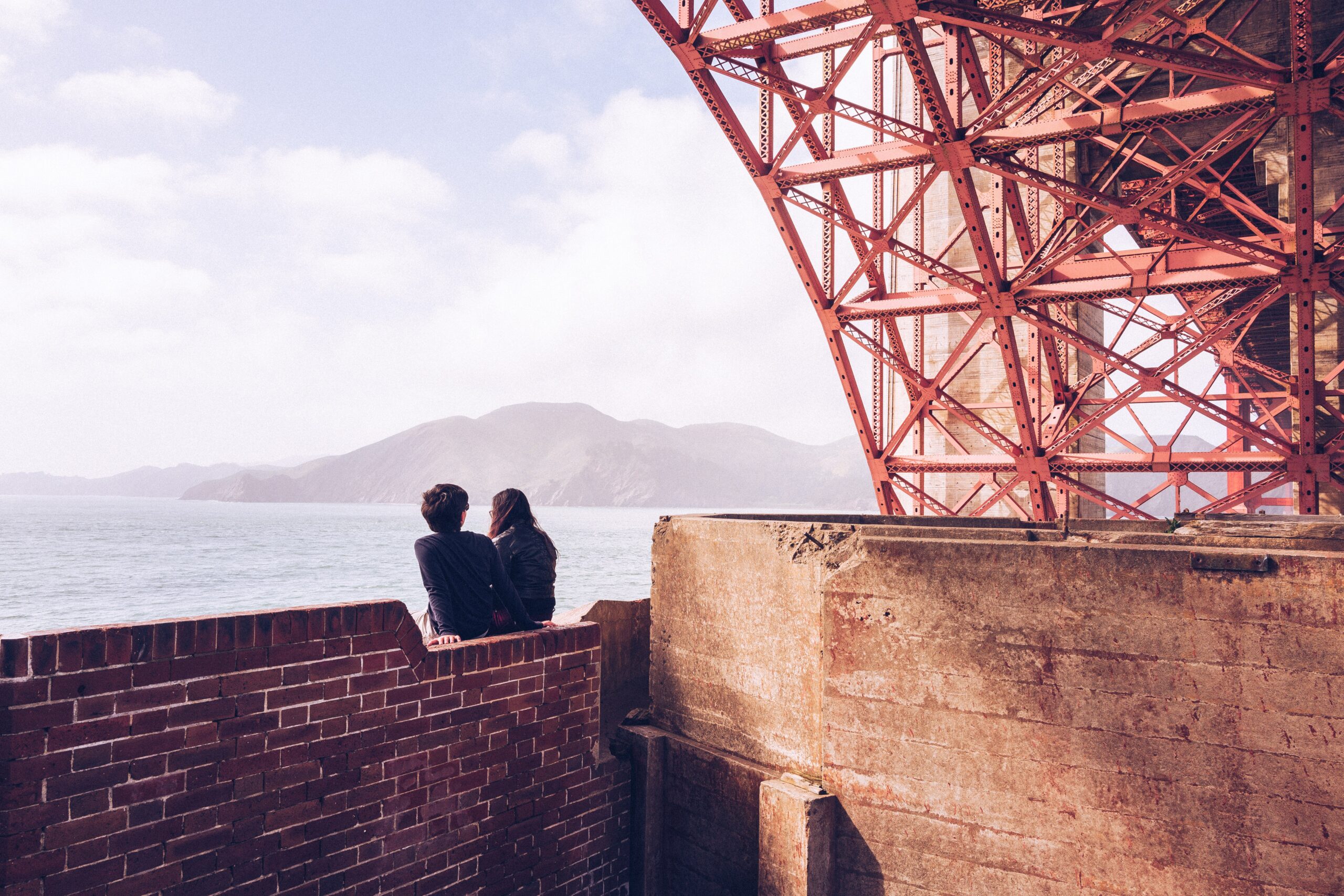 Couple on a san francisco date under the Golden Gate Bridge