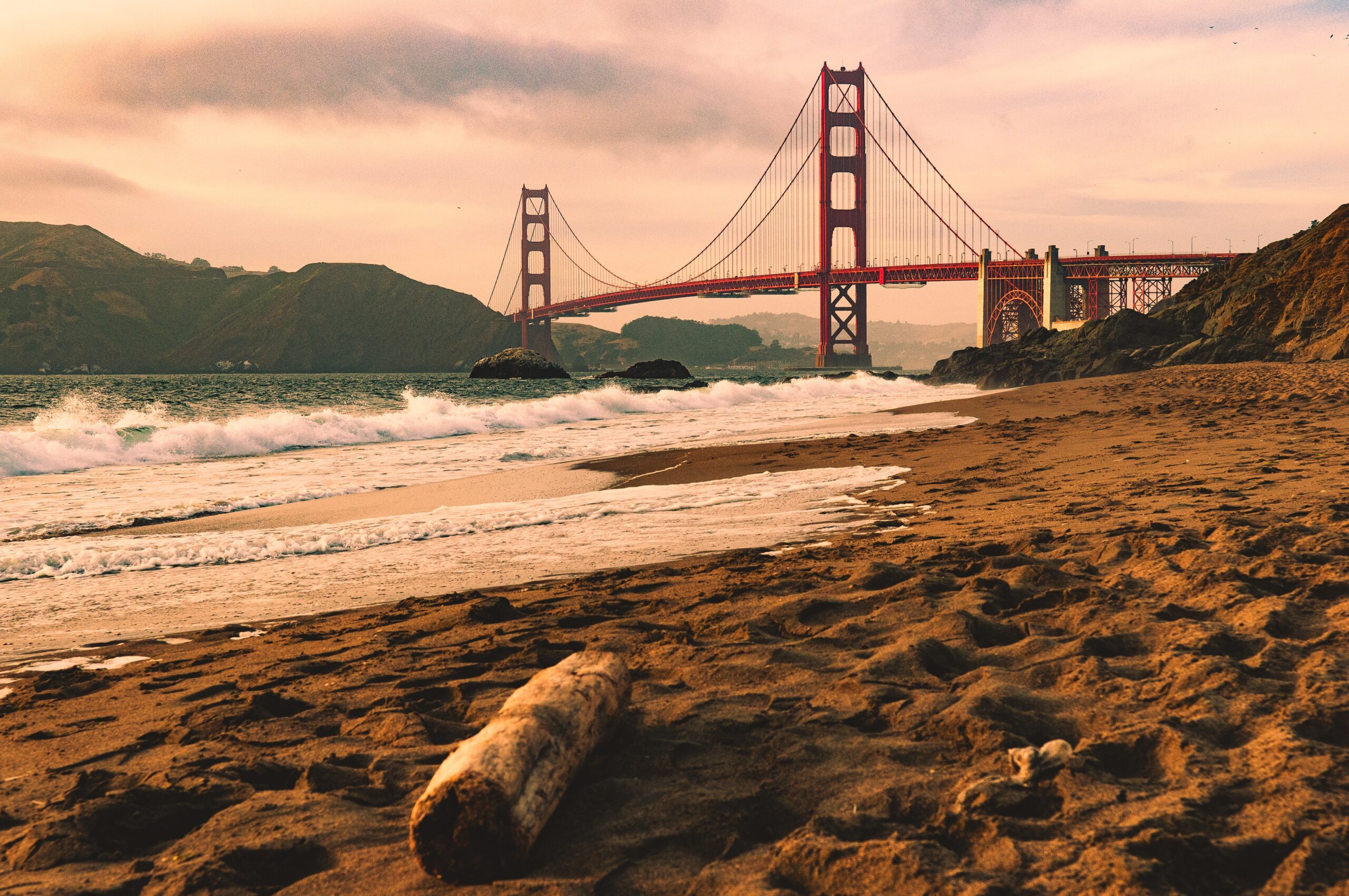Sunset view of the Golden Gate Bridge from Baker Beach, San Francisco